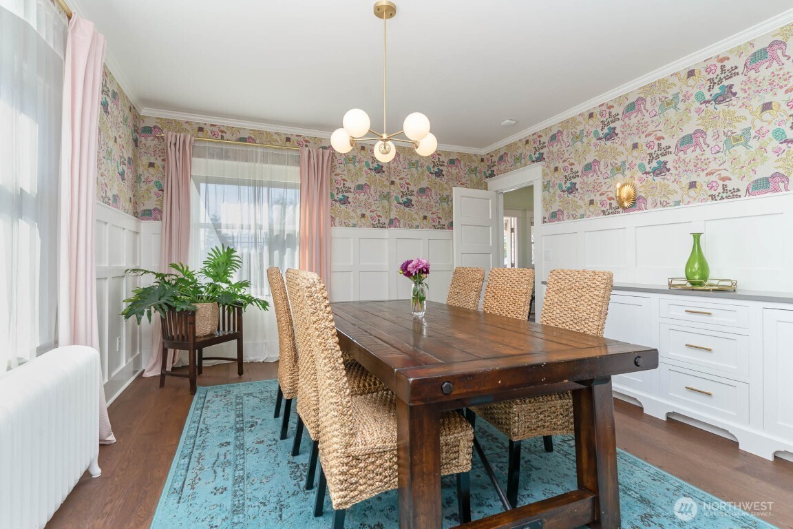 1607 6th Avenue West Seattle, WA 98119 - Photo 7 of 27 a view of a dining room with furniture and a chandelier