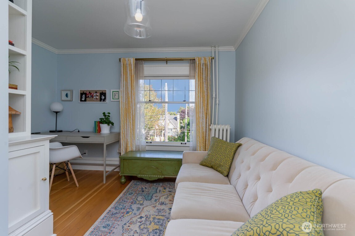 1607 6th Avenue West Seattle, WA 98119 - Photo 10 of 27 a living room with furniture and a window