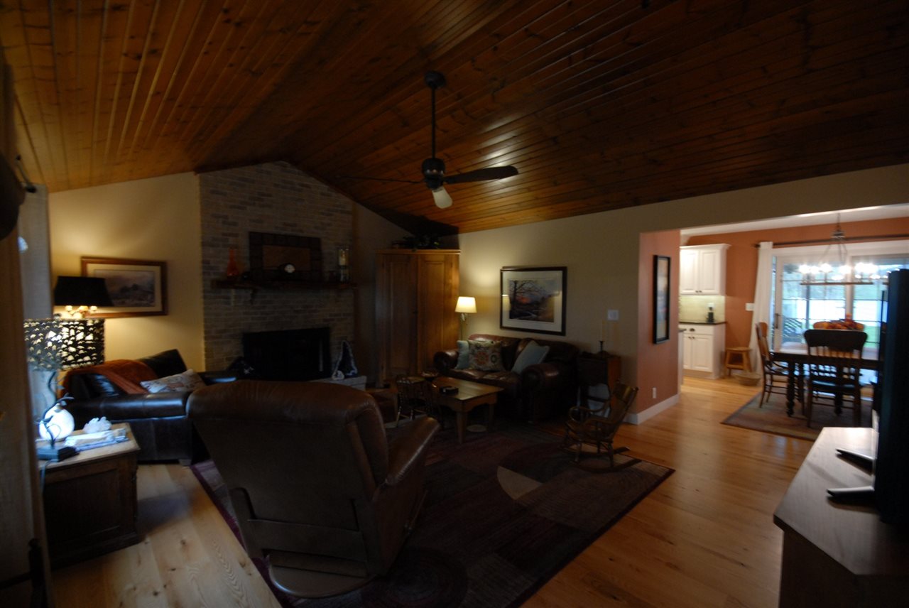 5525 Rural Edge Drive Roscoe, IL 61073 - Photo 12 of 21 a living room with furniture a flat screen tv and a fireplace