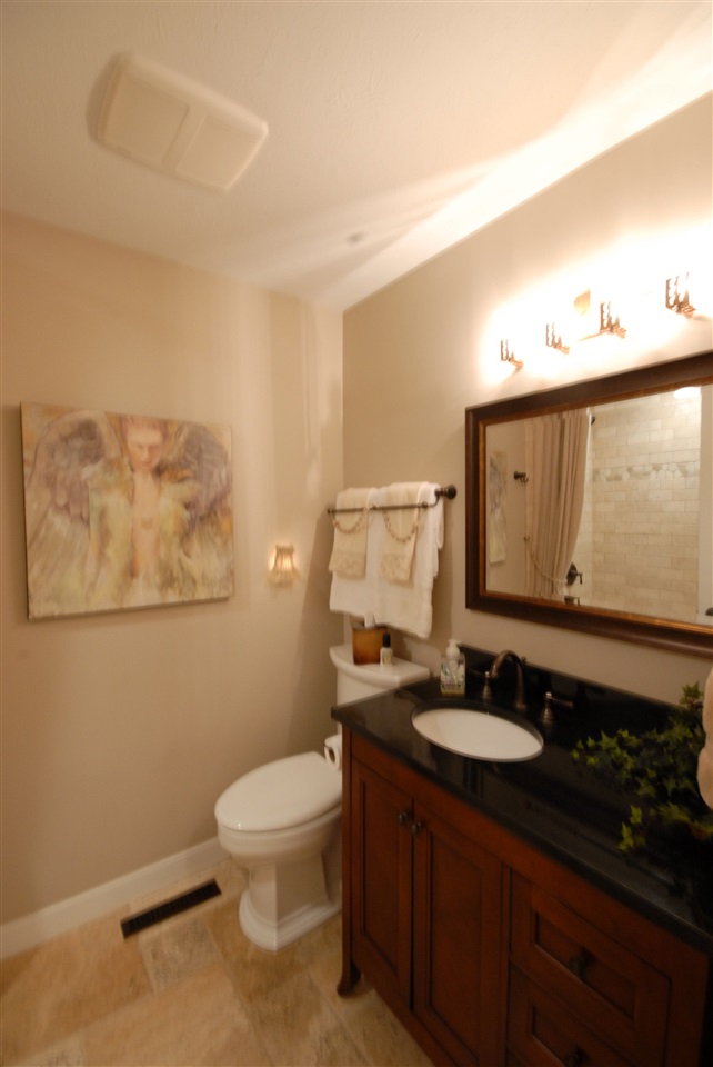 5525 Rural Edge Drive Roscoe, IL 61073 - Photo 15 of 21 a bathroom with a toilet sink and mirror