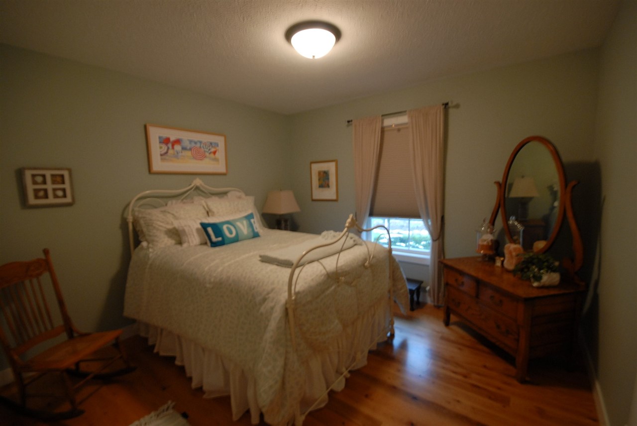 5525 Rural Edge Drive Roscoe, IL 61073 - Photo 17 of 21 a bed room with a bed and a dresser