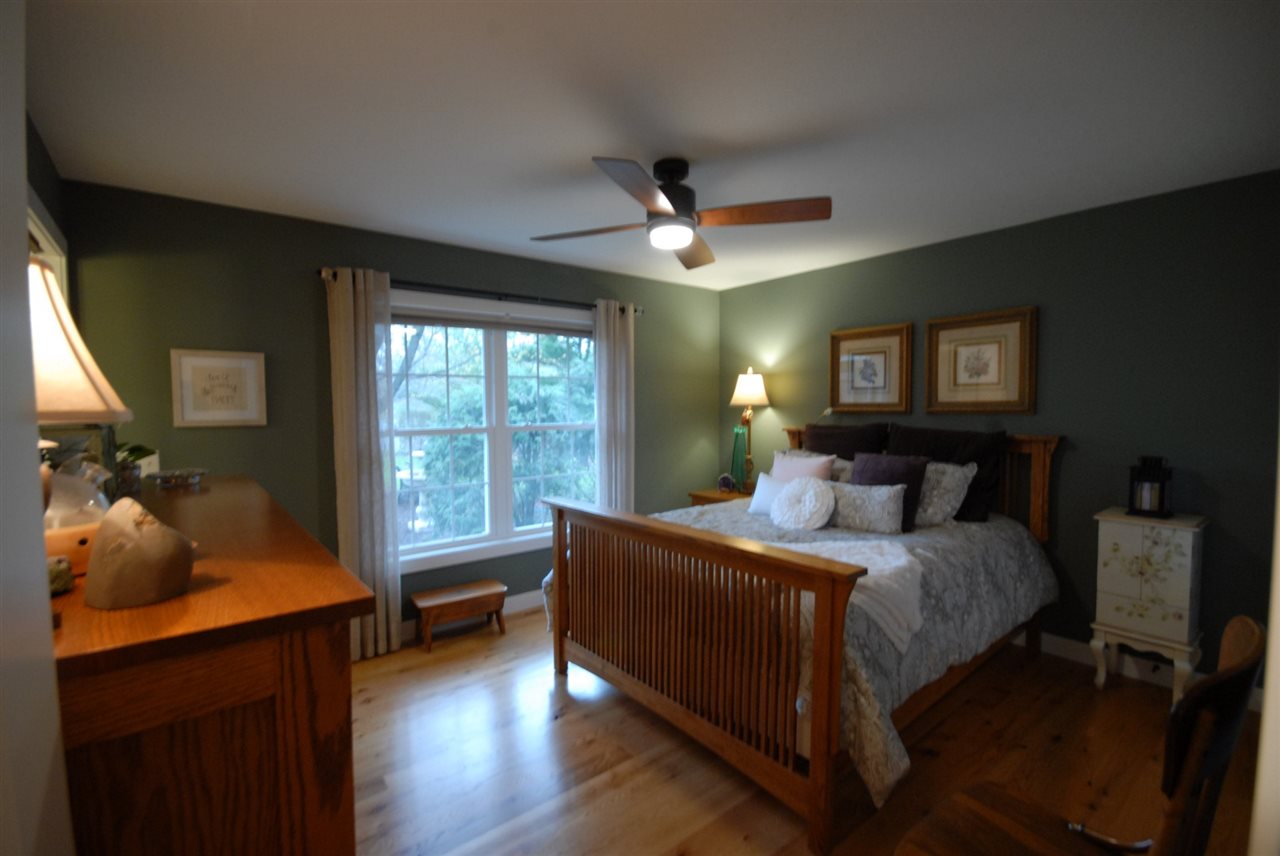 5525 Rural Edge Drive Roscoe, IL 61073 - Photo 18 of 21 a bedroom with a large bed and a large window