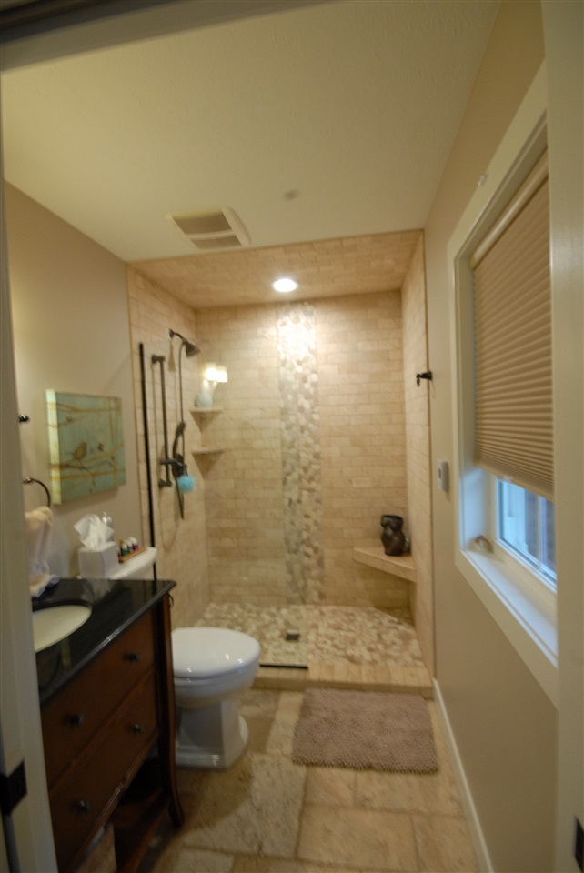 5525 Rural Edge Drive Roscoe, IL 61073 - Photo 20 of 21 a bathroom with a granite countertop sink a toilet and shower