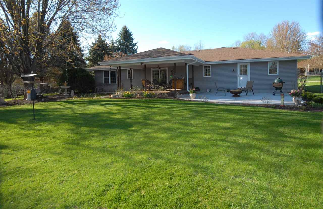 5525 Rural Edge Drive Roscoe, IL 61073 - Photo 3 of 21 a front view of a house with a garden
