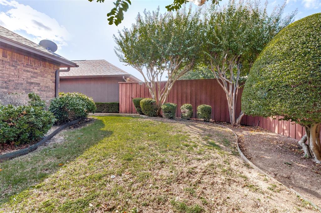 9121 Church Road Dallas, TX 75231 - Photo 11 of 13 a view of a backyard with potted plants and large tree
