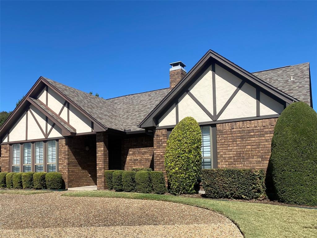 9121 Church Road Dallas, TX 75231 - Photo 12 of 13 a front view of a house with garden