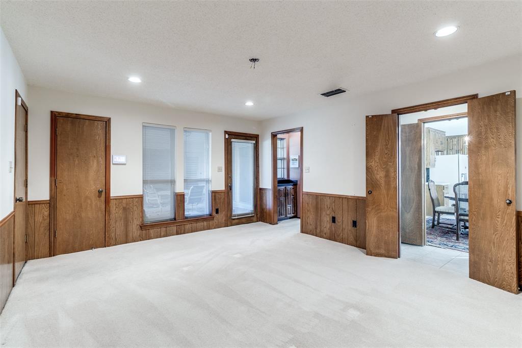 9121 Church Road Dallas, TX 75231 - Photo 4 of 13 a view of a big room with closet and windows