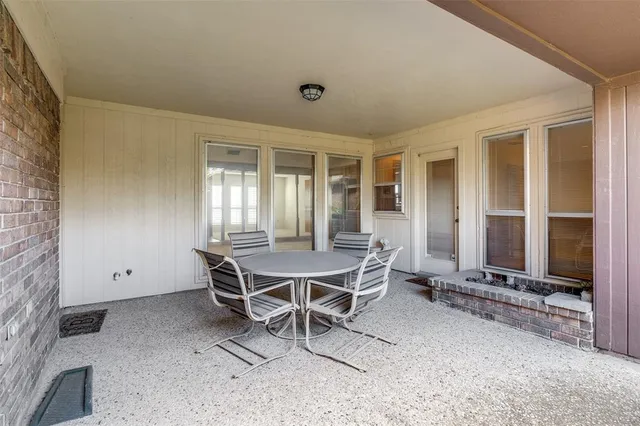 a dining room with furniture and windows