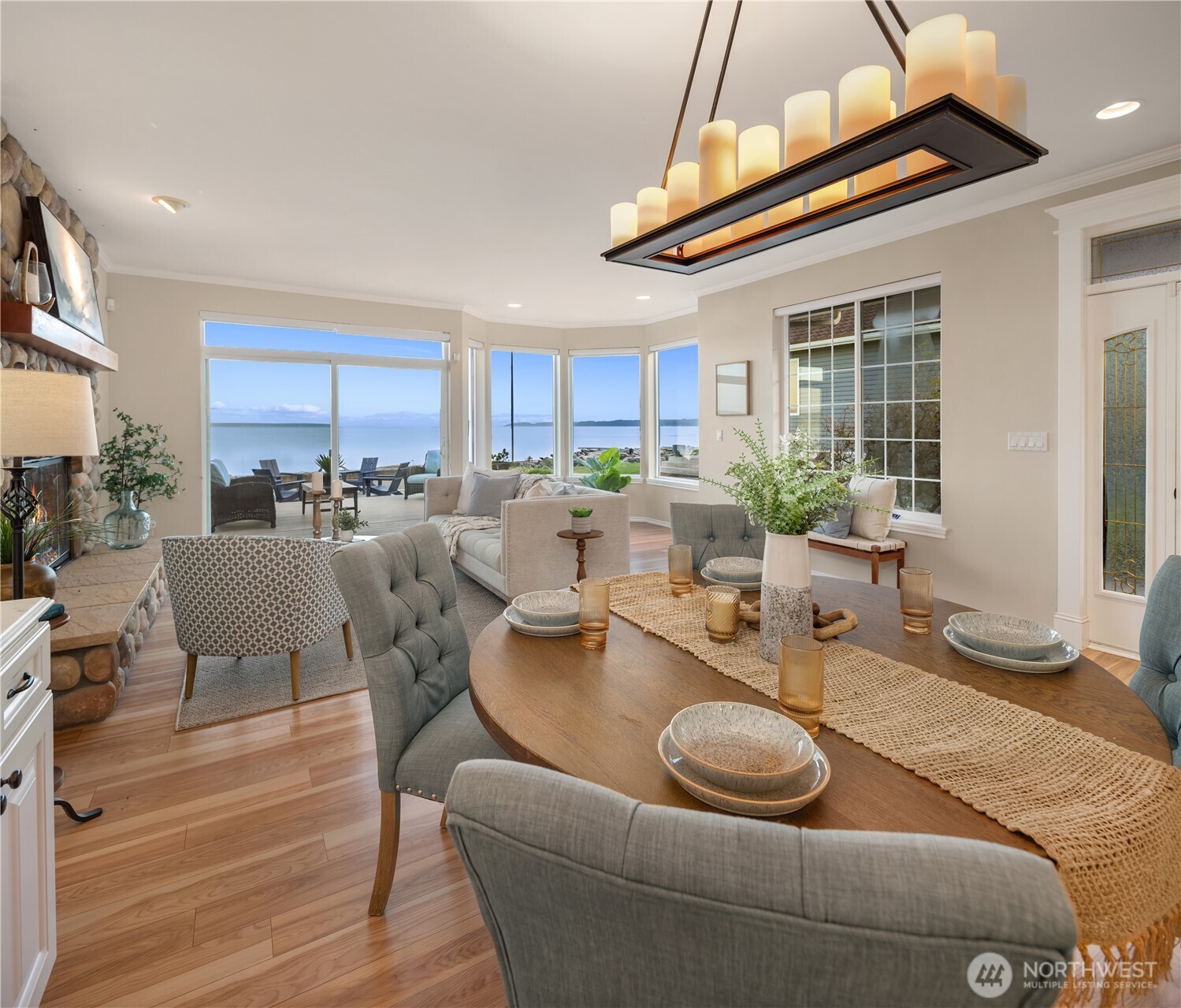 1882 Shore Avenue Freeland, WA 98249 - Photo 11 of 36 a dining room with furniture a window and wooden floor