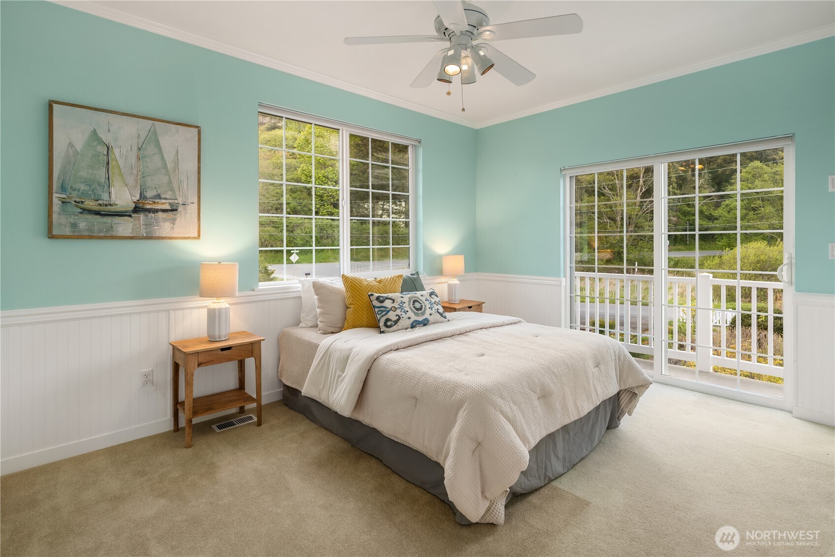 1882 Shore Avenue Freeland, WA 98249 - Photo 21 of 36 a spacious bedroom with a bed and a large window