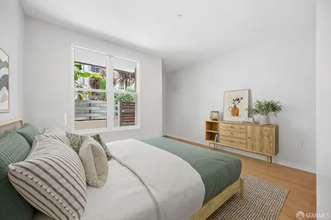 a bedroom with a bed and a couch