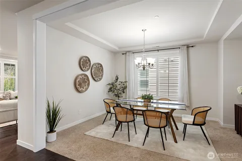 a view of a dining room with furniture and window