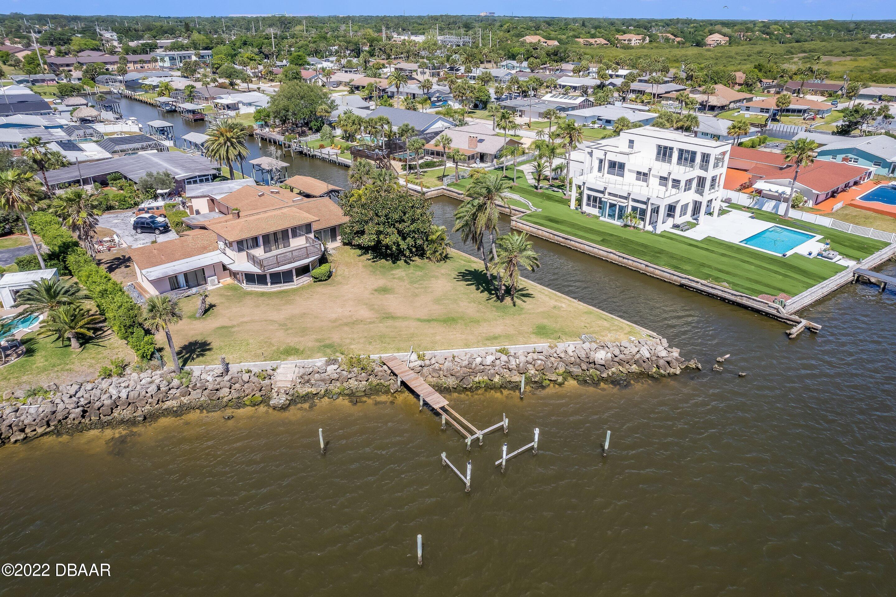 132 Reef Road South Daytona, FL 32119 - Photo 1 of 11 an aerial view of residential houses with outdoor space and ocean view