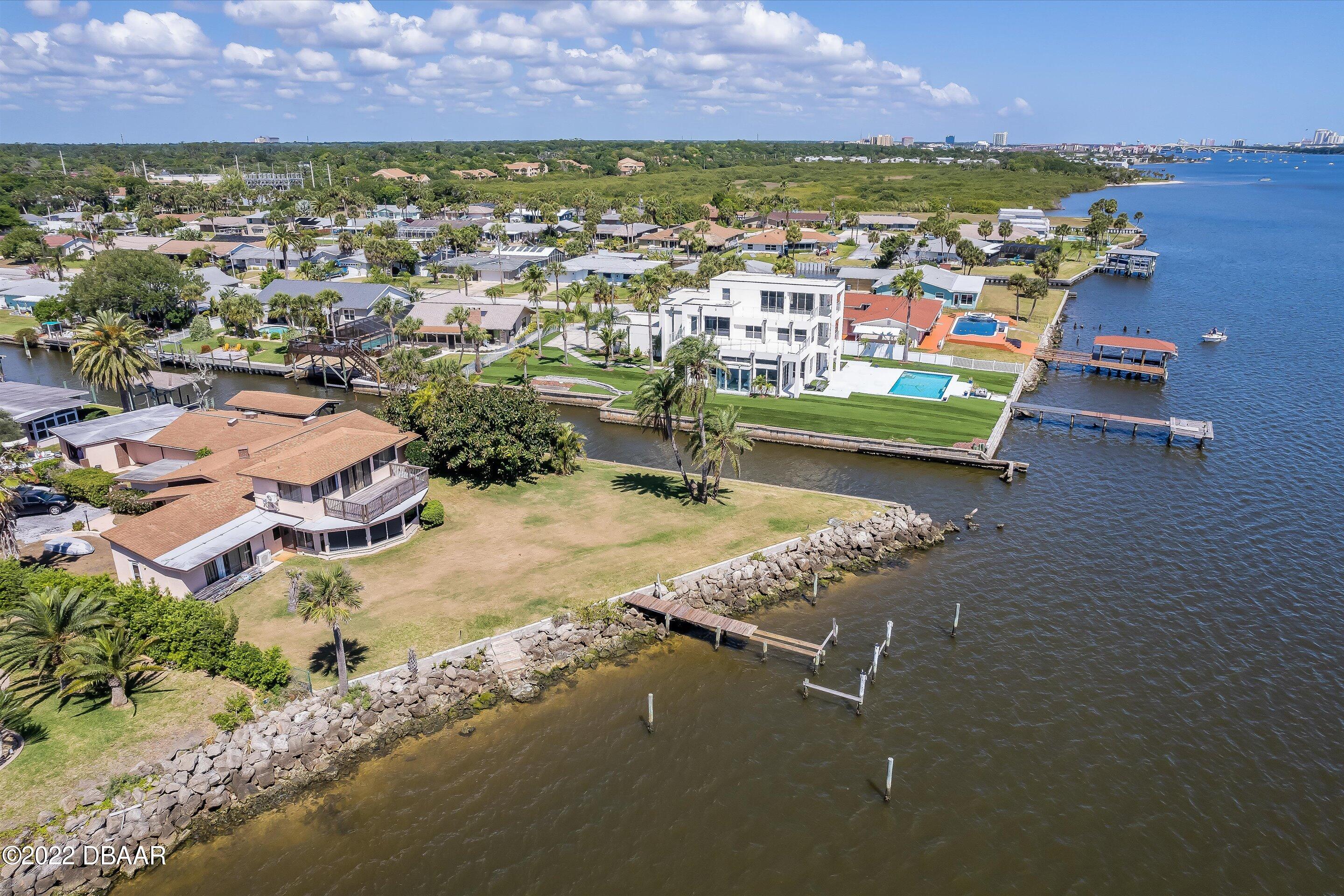 132 Reef Road South Daytona, FL 32119 - Photo 3 of 11 an aerial view of residential houses with outdoor space and seating