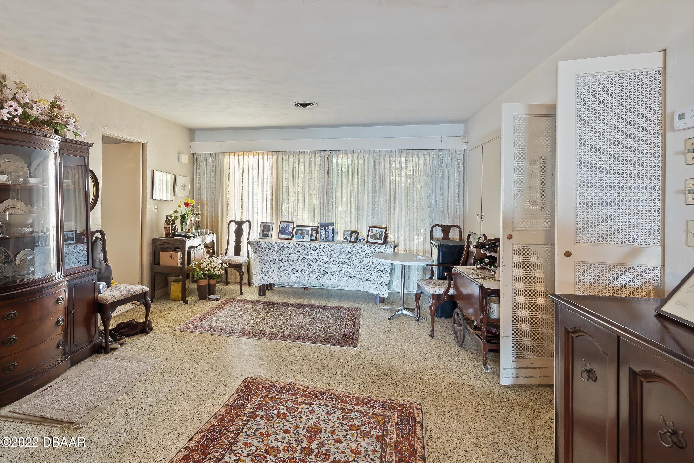 132 Reef Road South Daytona, FL 32119 - Photo 7 of 11 a living room with furniture rug and window