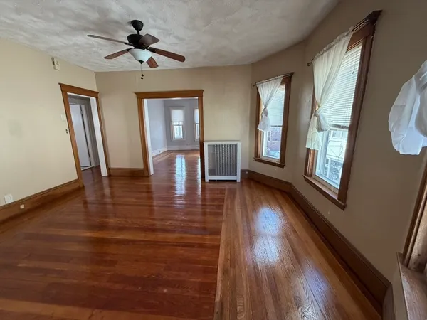 a view of an entryway with wooden floor and a window