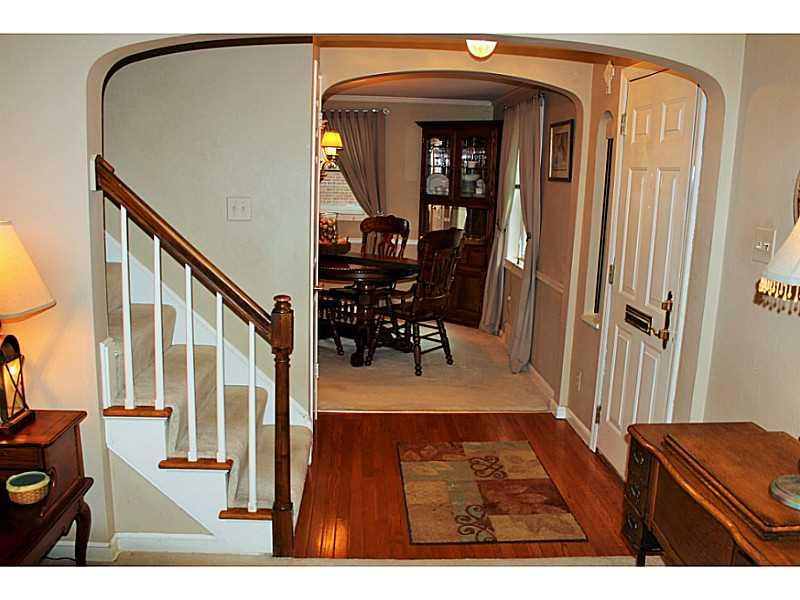 131 Orchard Spring Road Pittsburgh, PA 15220 - Photo 3 of 25 Entry/Foyer. Beautiful hardwood floor and stairway with neutral carpeting welcome you inside.
