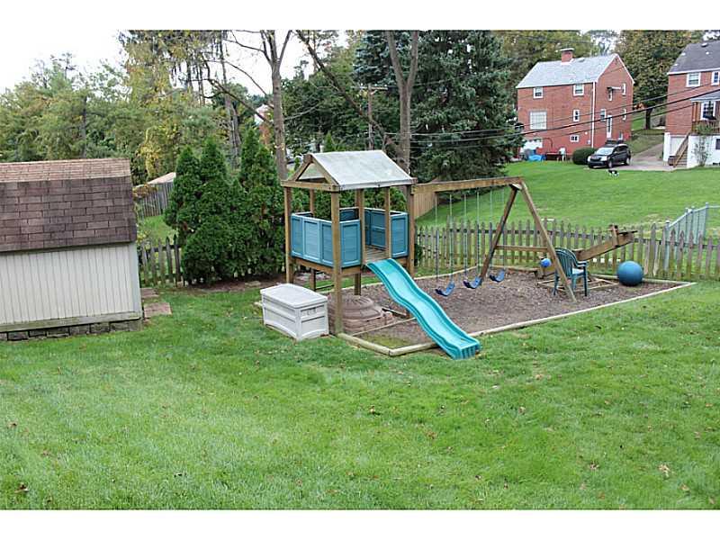 131 Orchard Spring Road Pittsburgh, PA 15220 - Photo 23 of 25 Yard/Garden. Fenced yard with swing set for the kids and a shed for additional storage.