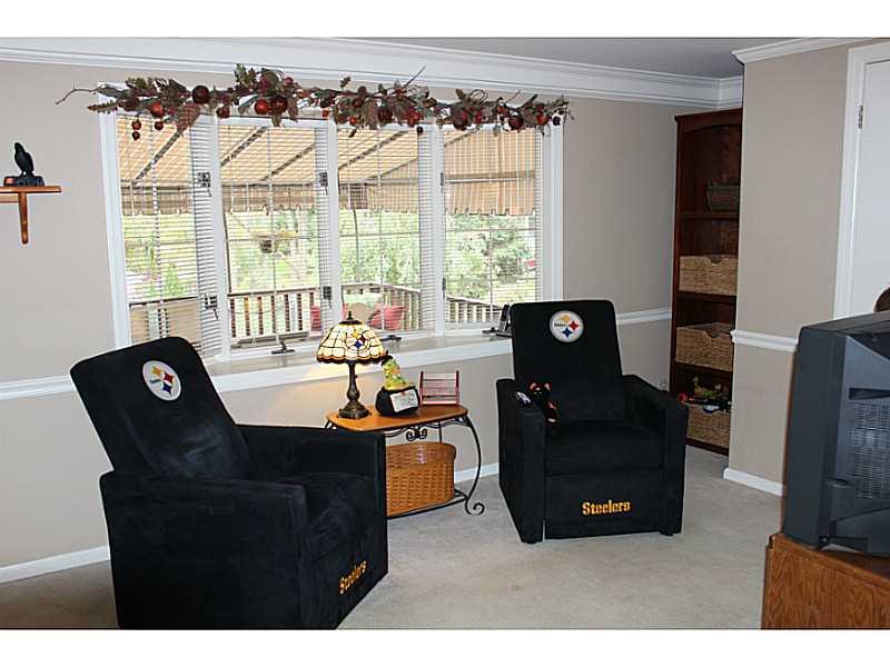 131 Orchard Spring Road Pittsburgh, PA 15220 - Photo 6 of 25 Family Room. Family room addition features neutral carpeting, crown molding, chair rail and a bay window which overlooks the deck and rear yard.