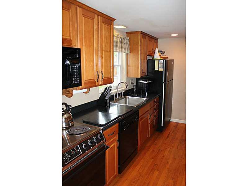 131 Orchard Spring Road Pittsburgh, PA 15220 - Photo 8 of 25 Kitchen. All appliances included in the kitchen with Corian counter tops.
