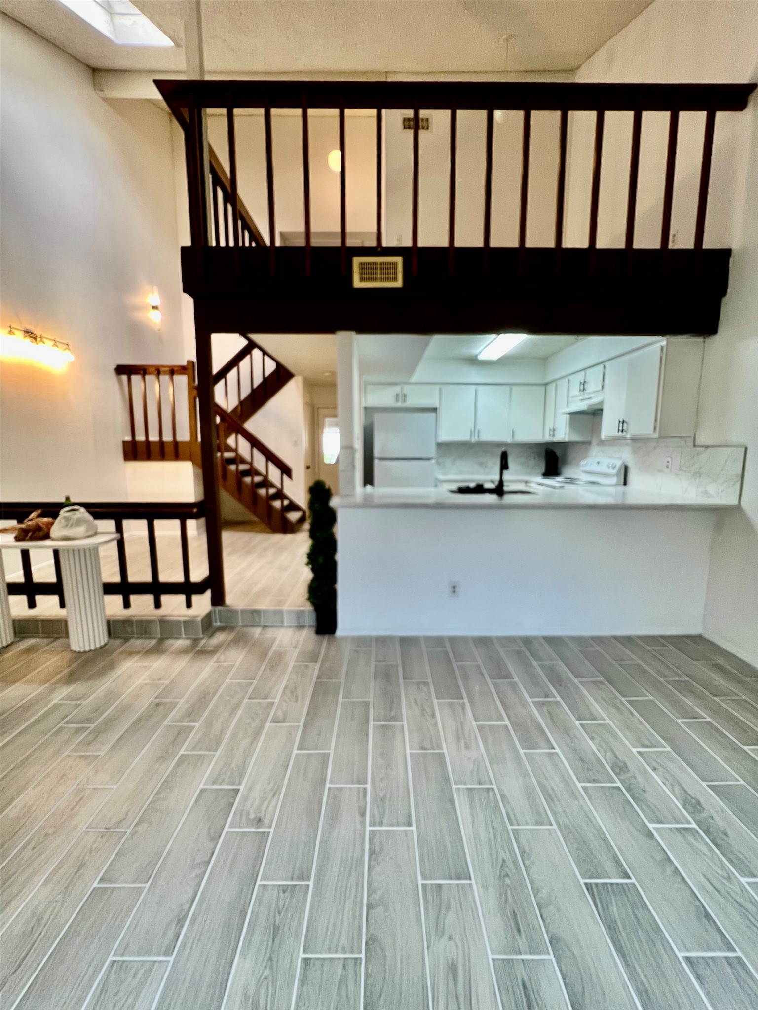 12922 Wirevine Lane Houston, TX 77072 - Photo 18 of 26 a view of entryway with wooden floor
