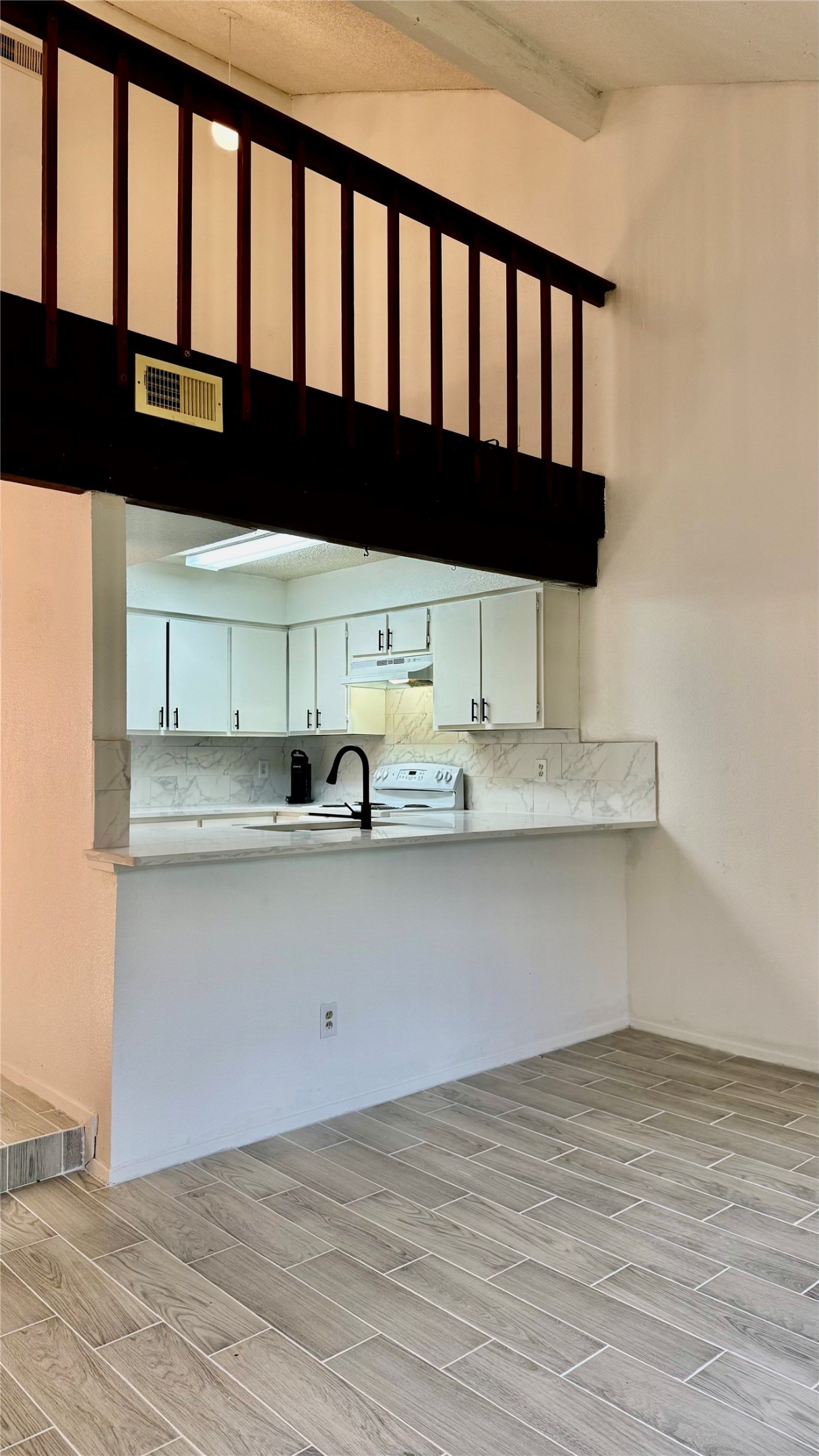 12922 Wirevine Lane Houston, TX 77072 - Photo 19 of 26 a kitchen with a sink and cabinets