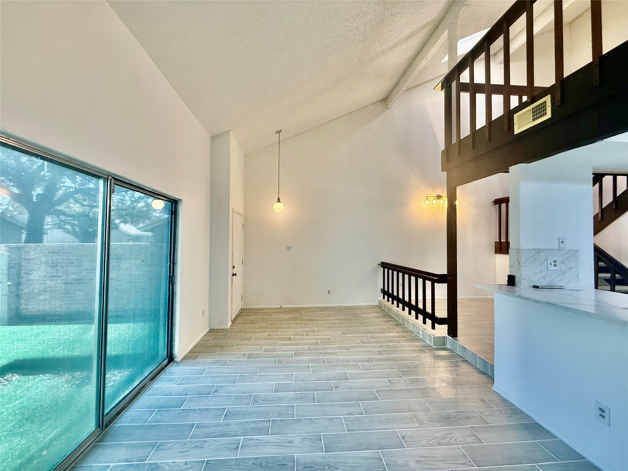 12922 Wirevine Lane Houston, TX 77072 - Photo 3 of 26 a view of a hallway with windows