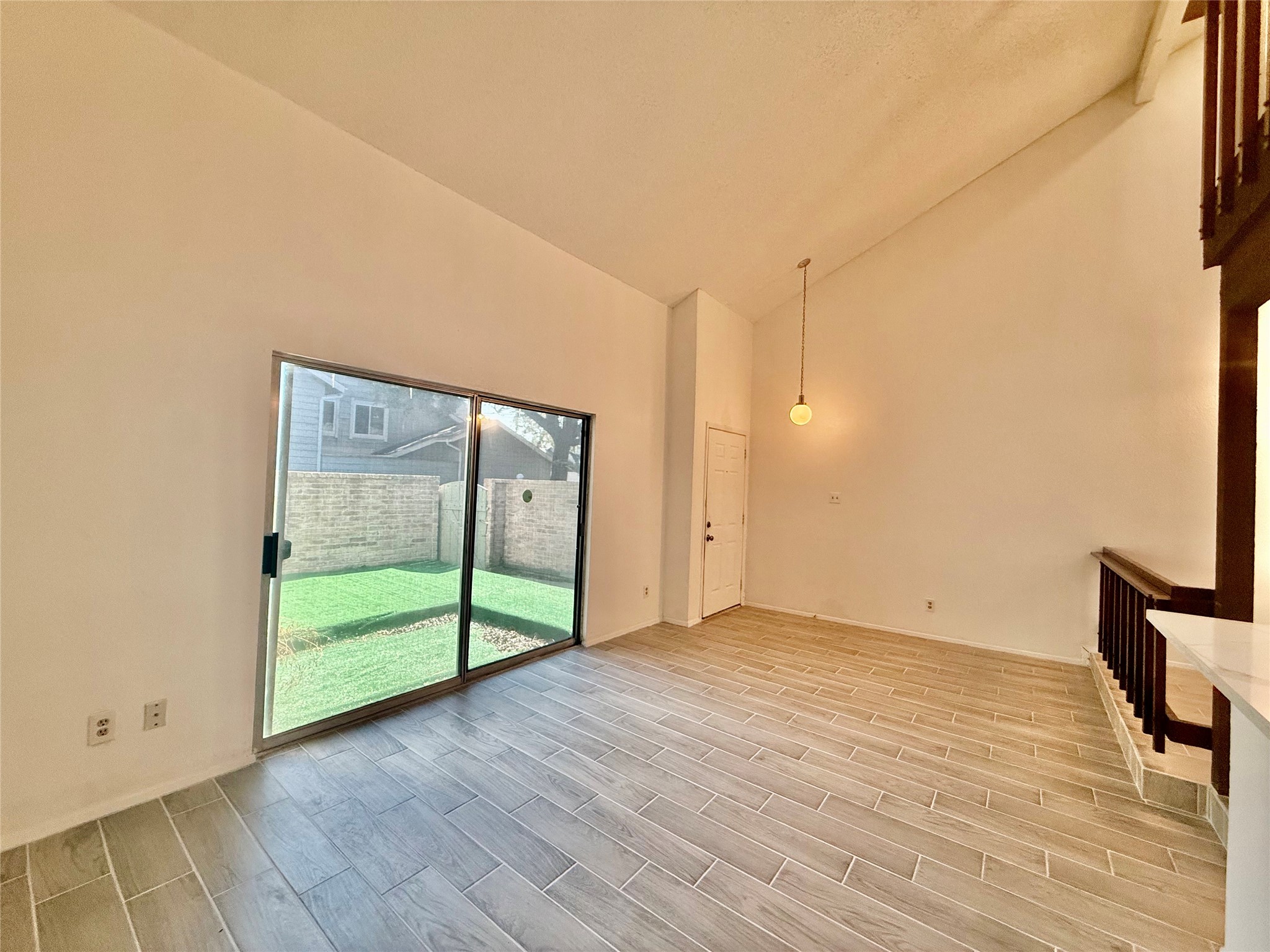 12922 Wirevine Lane Houston, TX 77072 - Photo 8 of 26 a view of an empty room with wooden floor and a window