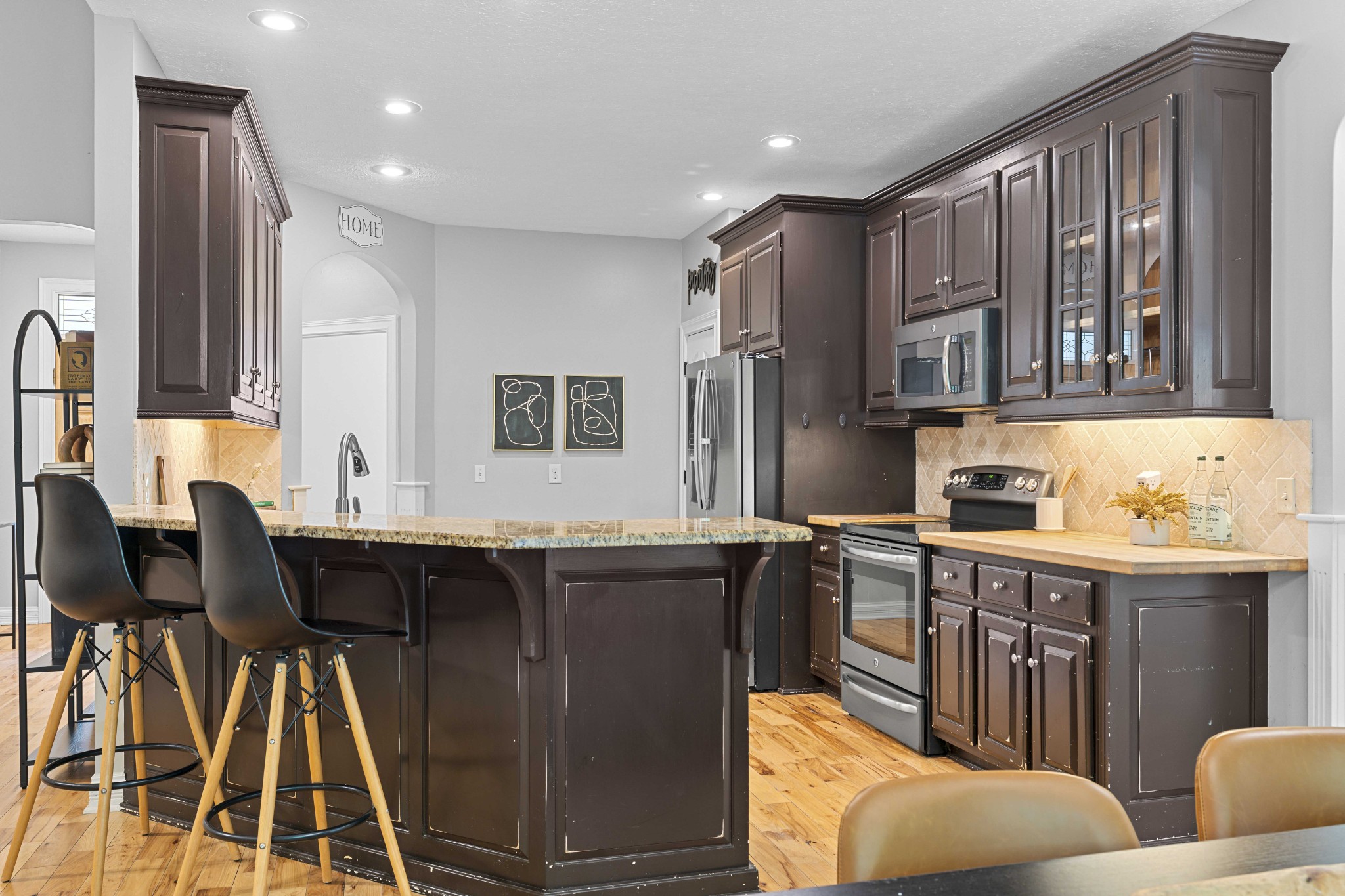 7339 Chowning Road Springfield, TN 37172 - Photo 16 of 57 a kitchen with a table chairs refrigerator and cabinets