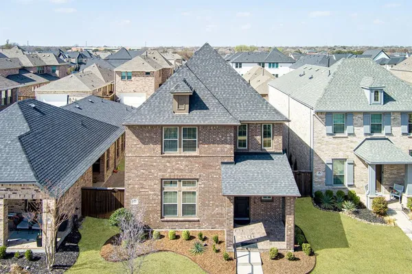 a aerial view of a house with a patio