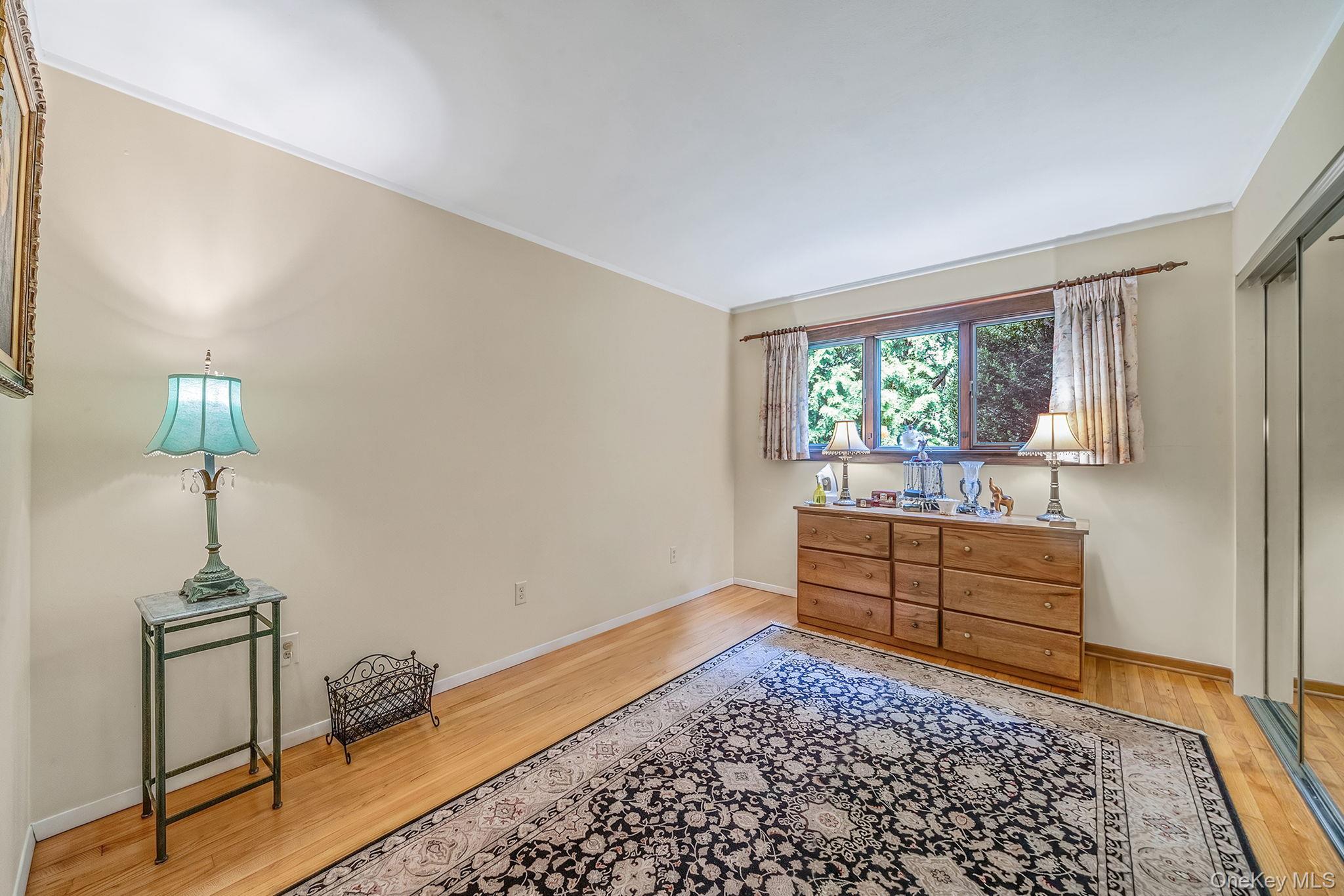 280 Deforest Road North Dix Hills, NY 11746 - Photo 24 of 37 a room with a bed and a window