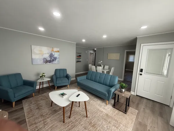 a living room with furniture and a rug