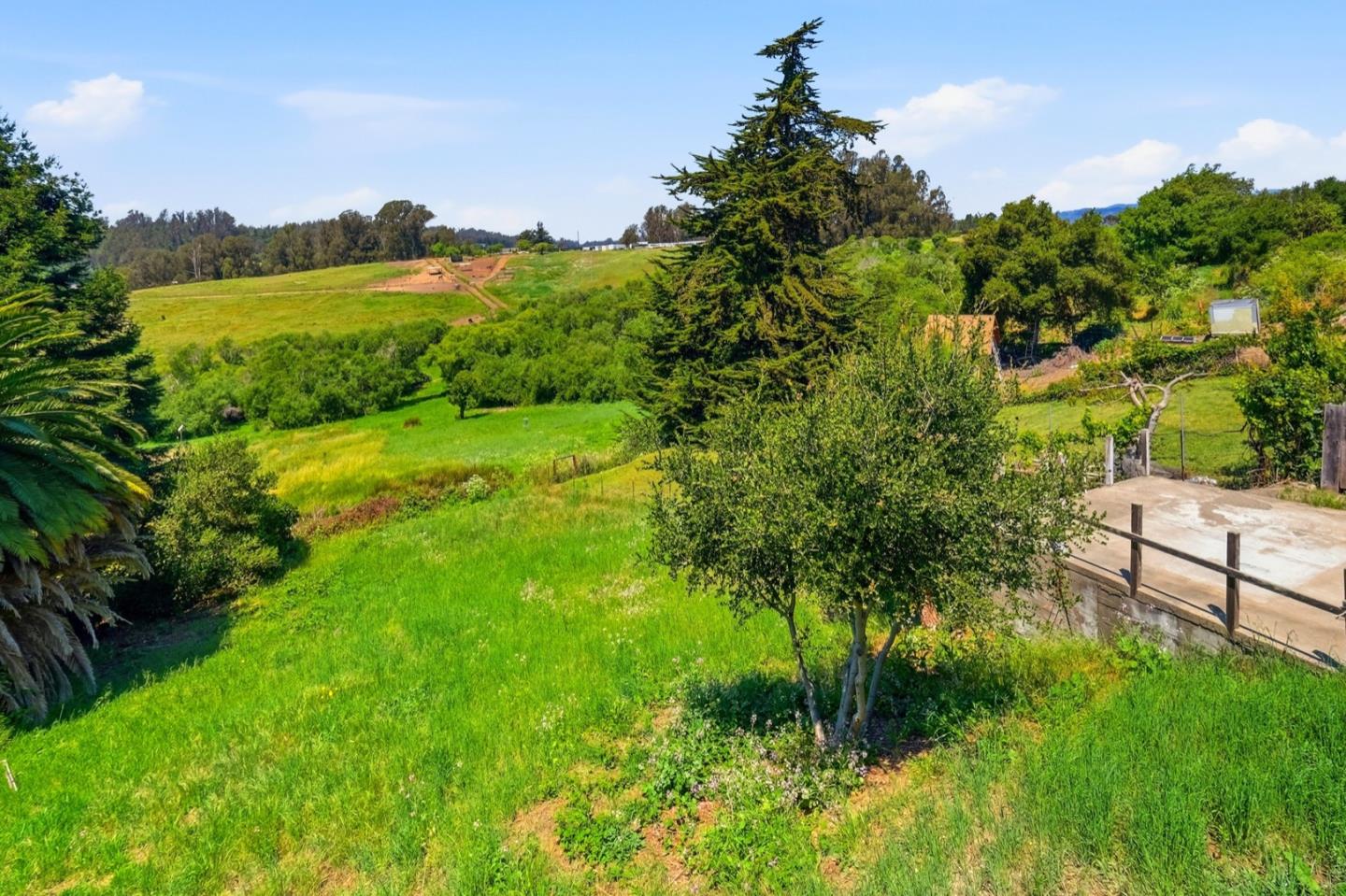 215 Manfre Road Watsonville, CA 95076 - Photo 28 of 36 a view of a lush green outdoor space with a lake view