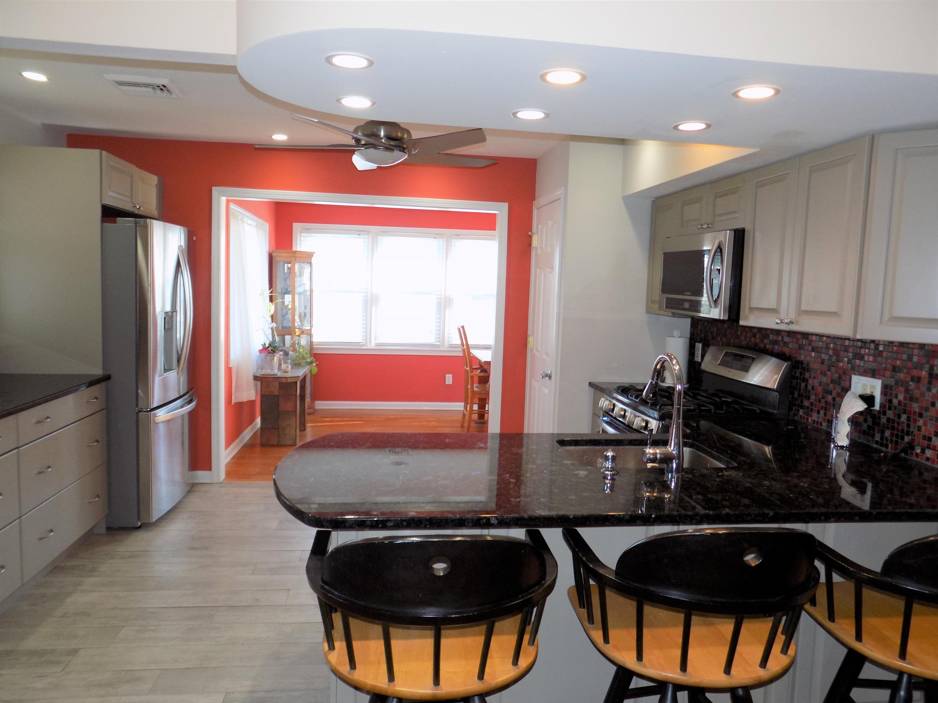 116 Gary Road Toms River, NJ 08753 - Photo 11 of 42 a room with table or chairs and a refrigerator