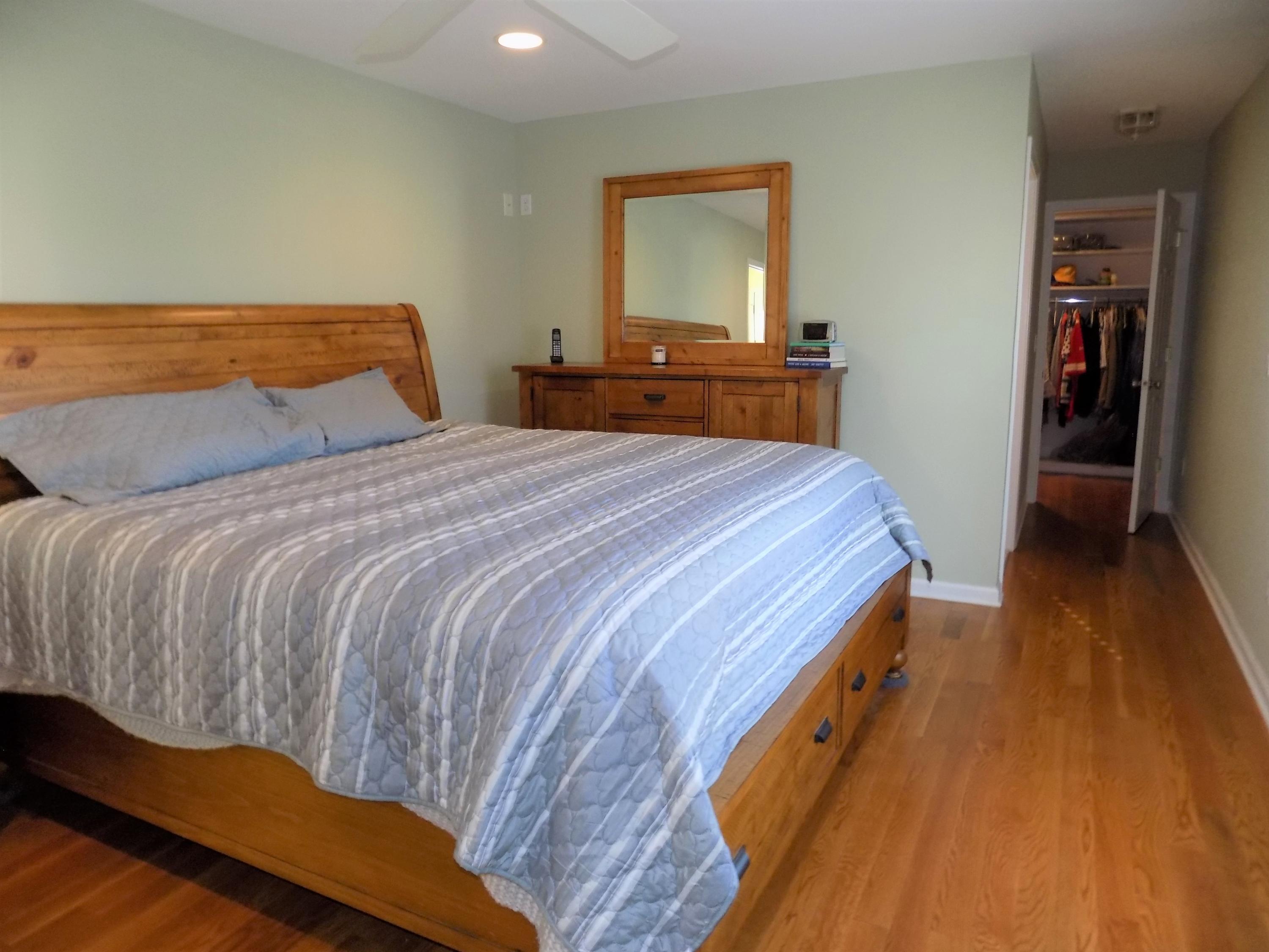 116 Gary Road Toms River, NJ 08753 - Photo 18 of 42 a bedroom with a bed and wooden floor