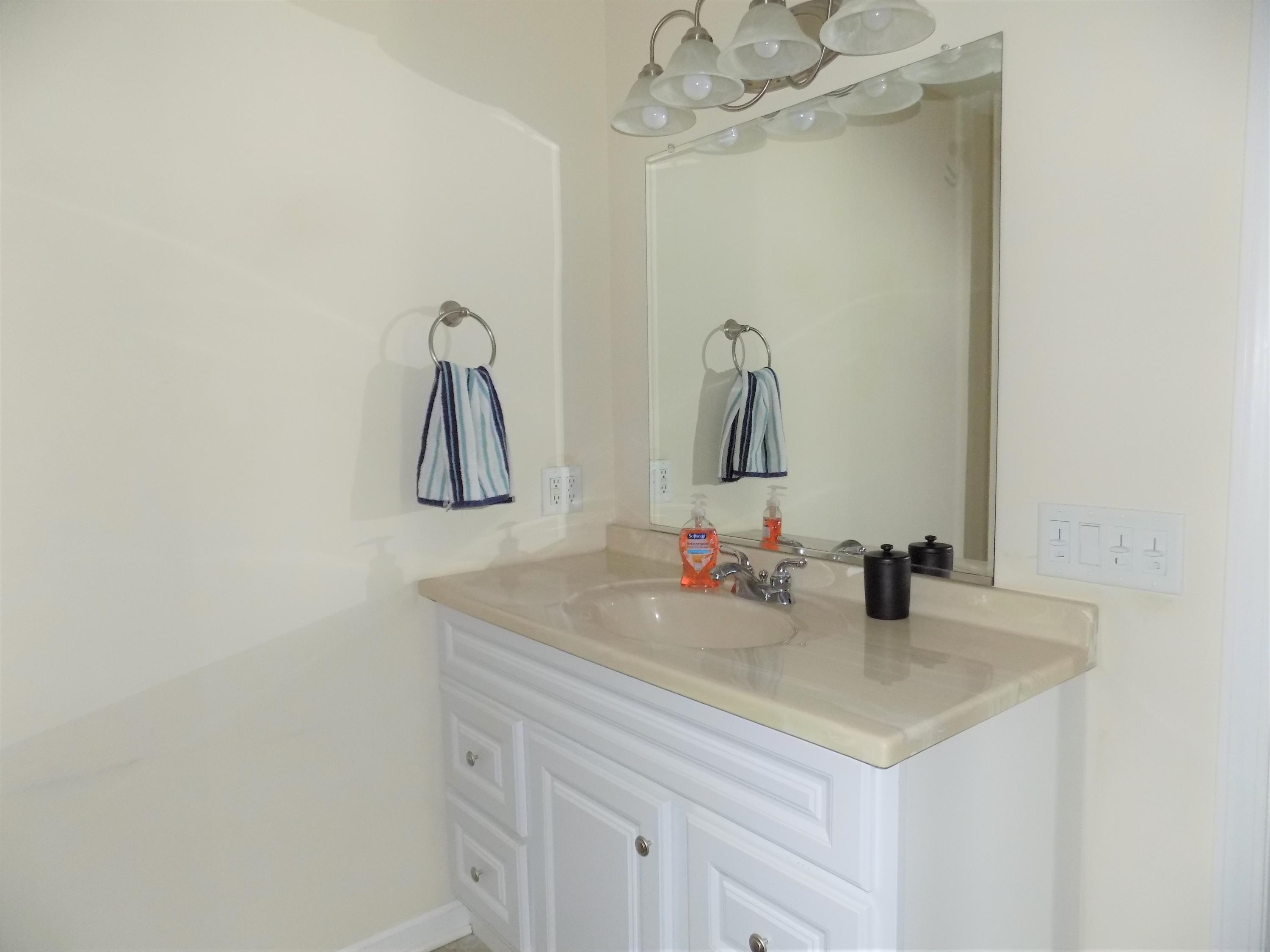 116 Gary Road Toms River, NJ 08753 - Photo 20 of 42 a bathroom with a sink and a mirror