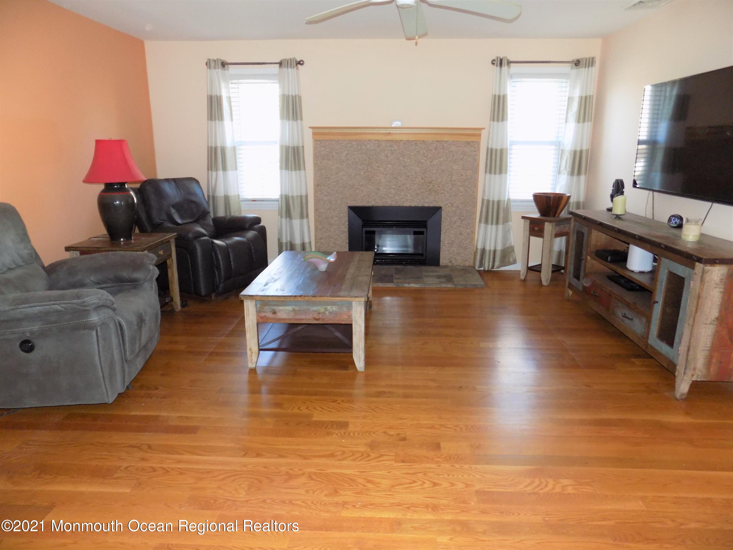 116 Gary Road Toms River, NJ 08753 - Photo 9 of 42 a living room with furniture and a fireplace