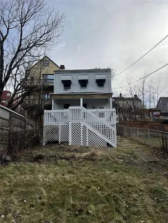 a view of a house with a fence