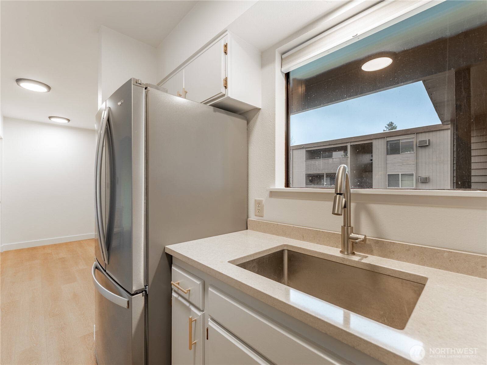 429 King Street, Unit 332 Wenatchee, WA 98801 - Photo 12 of 32 a kitchen with a refrigerator and a sink