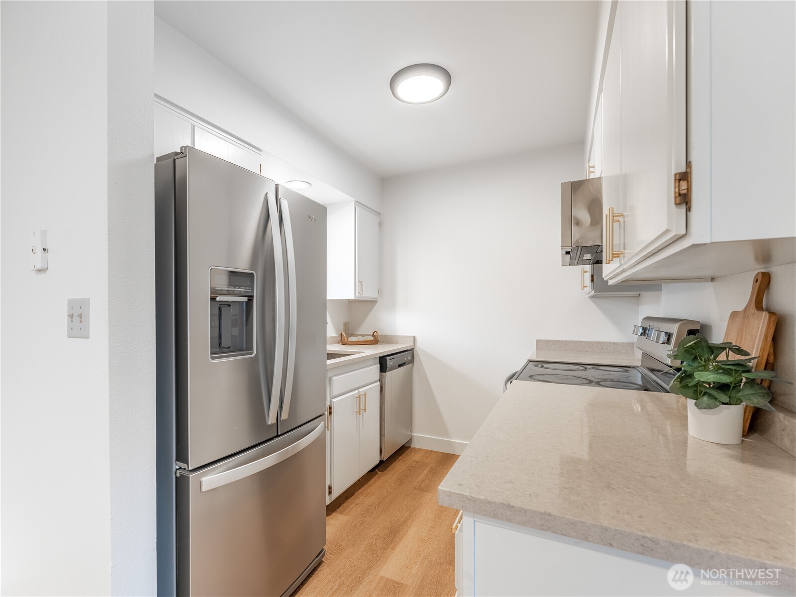 429 King Street, Unit 332 Wenatchee, WA 98801 - Photo 13 of 32 a kitchen with stainless steel appliances granite countertop a refrigerator and a sink