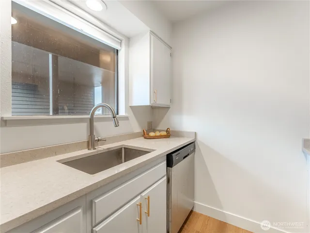 a view white cabinets and a sink