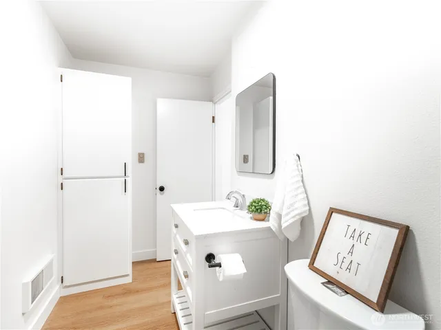 a bathroom with a sink a mirror and a shower