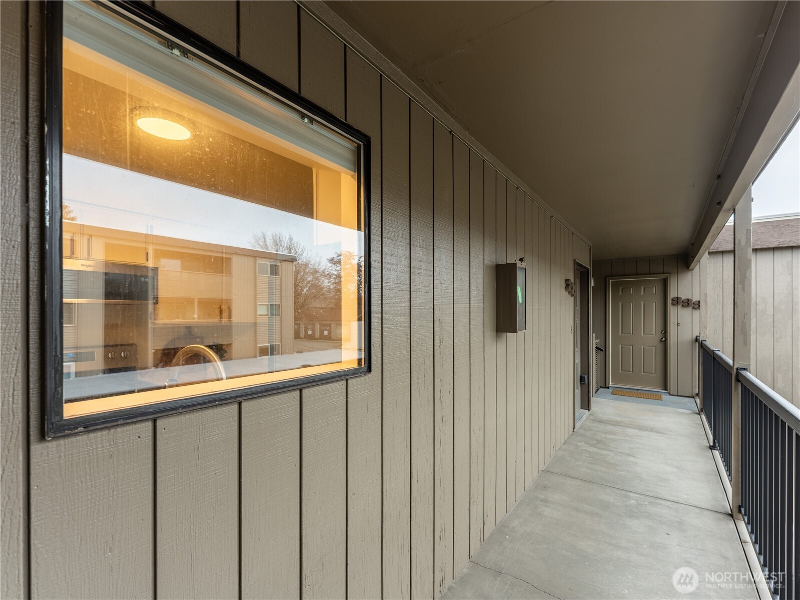 429 King Street, Unit 332 Wenatchee, WA 98801 - Photo 5 of 32 a view of a porch with wooden floor and windows