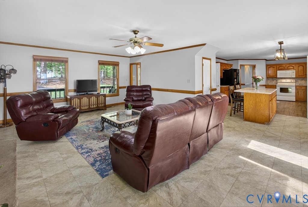173 Covenant Way Bumpass, VA 23024 - Photo 25 of 63 Spacious living area featuring tiled flooring, a c
