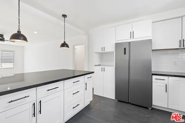 a view of a storage & utility room with wooden floor