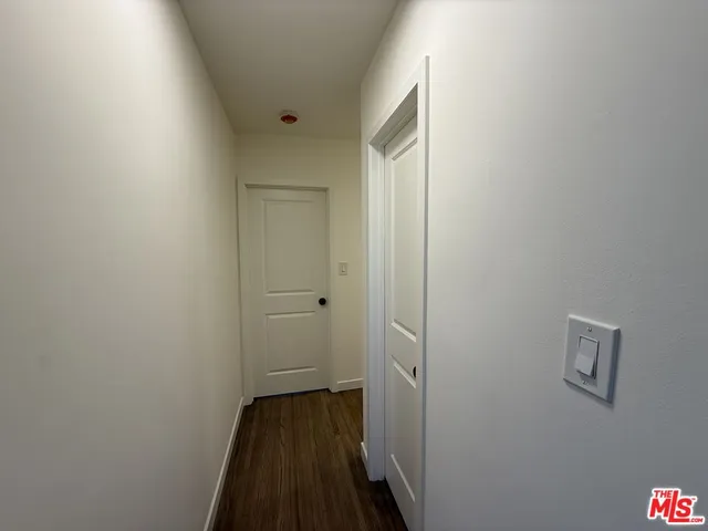 a kitchen with stainless steel appliances a sink stove and cabinets
