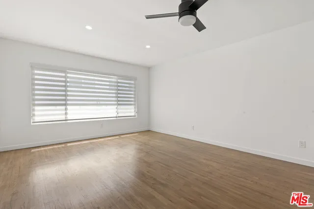 a kitchen with granite countertop a sink and cabinets