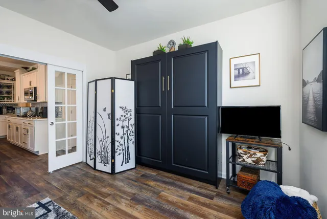 a view of a livingroom with furniture and a flat screen tv