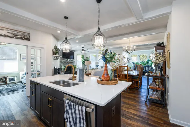 a kitchen with sink and refrigerator
