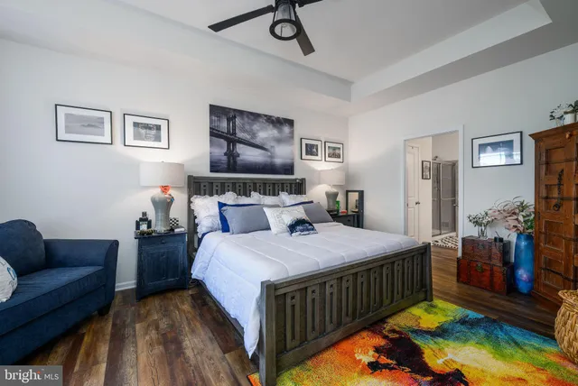 a bedroom with bed and a couch